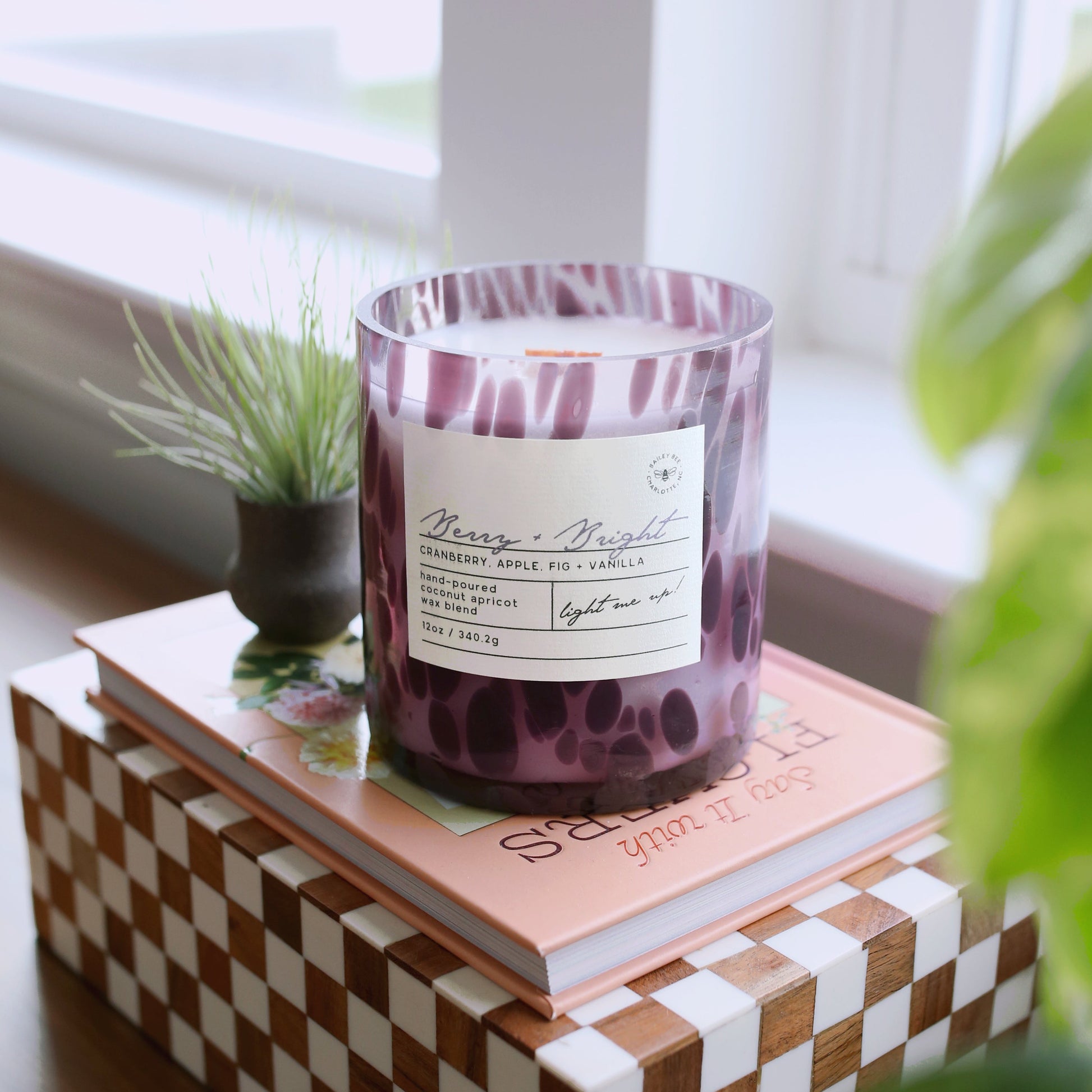 purple spotted candle with wooden wick