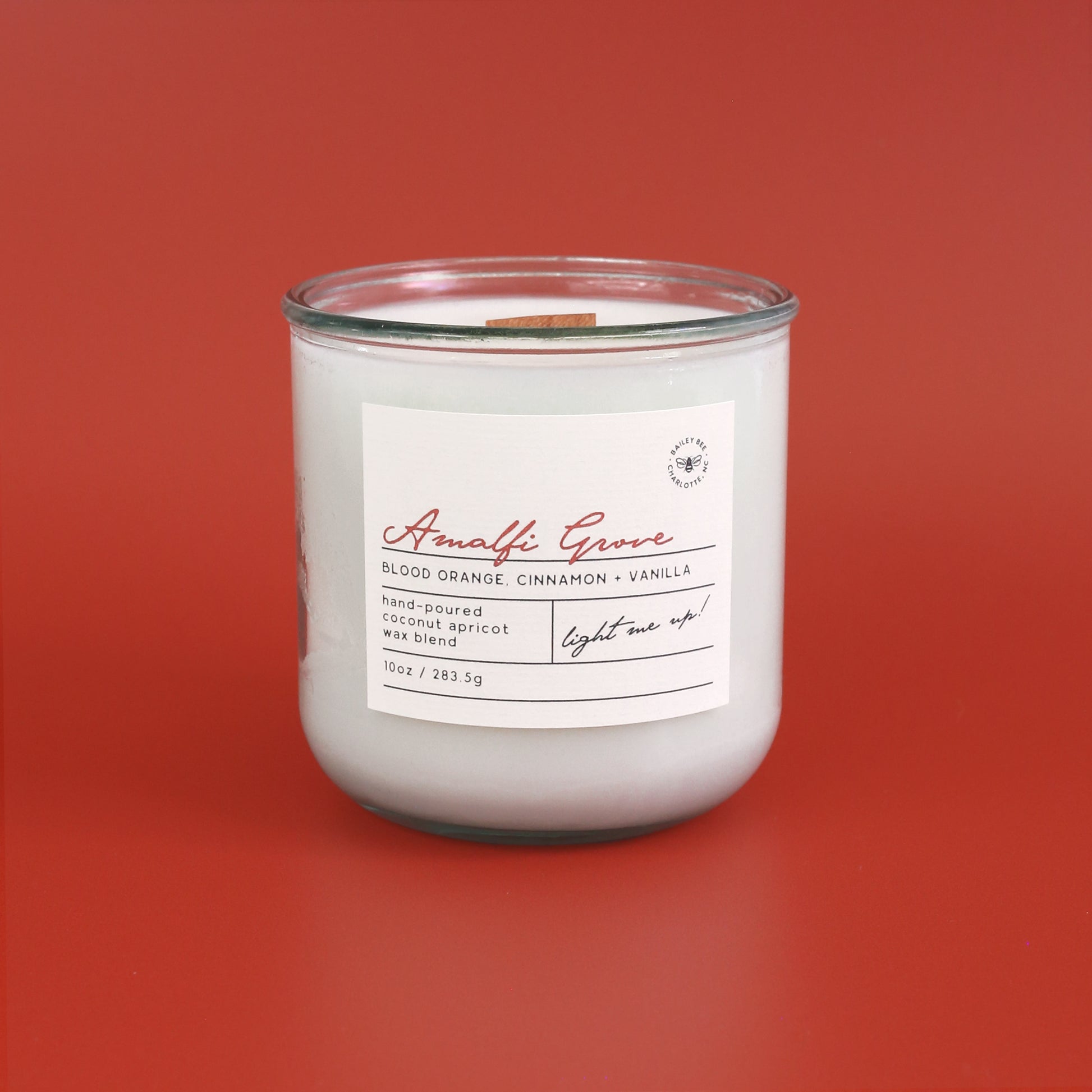 Candle with a label on a red background